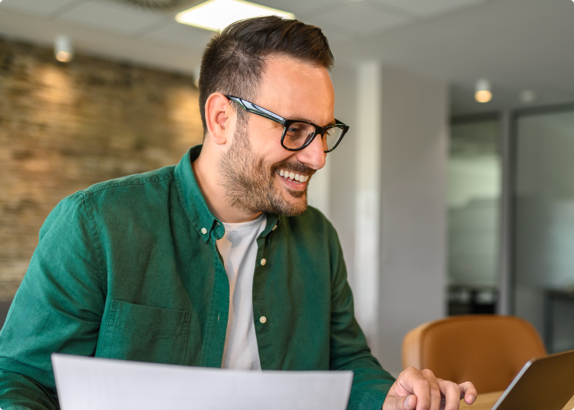 Man on call, working with Laptop
