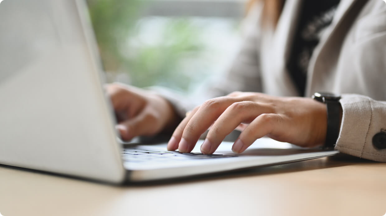 Person typing in laptop